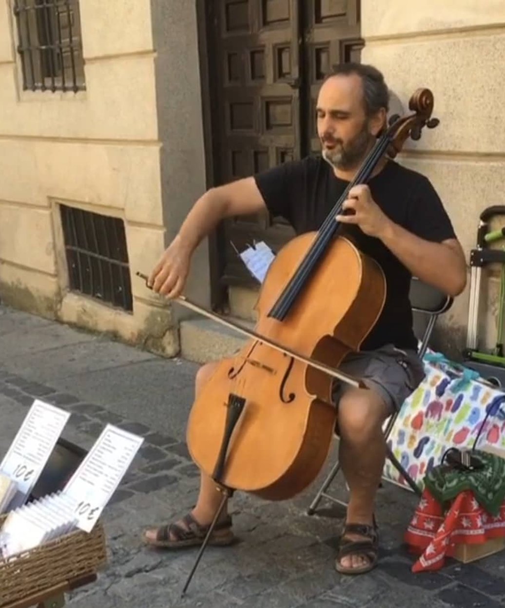 Man playing cello outdoors